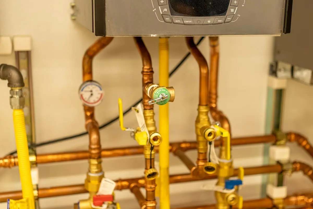 Licensed technician providing Water Heater Installation for a homeowner in Harrietstown